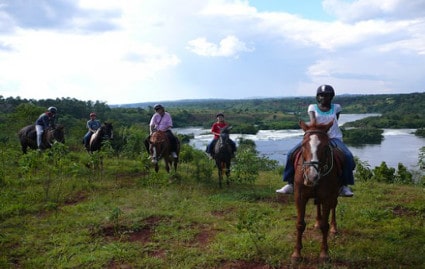 Tourists Horseback riding in Jinja